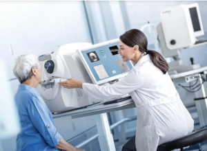 Doctor using optical coherence tomography (OCT) on patient